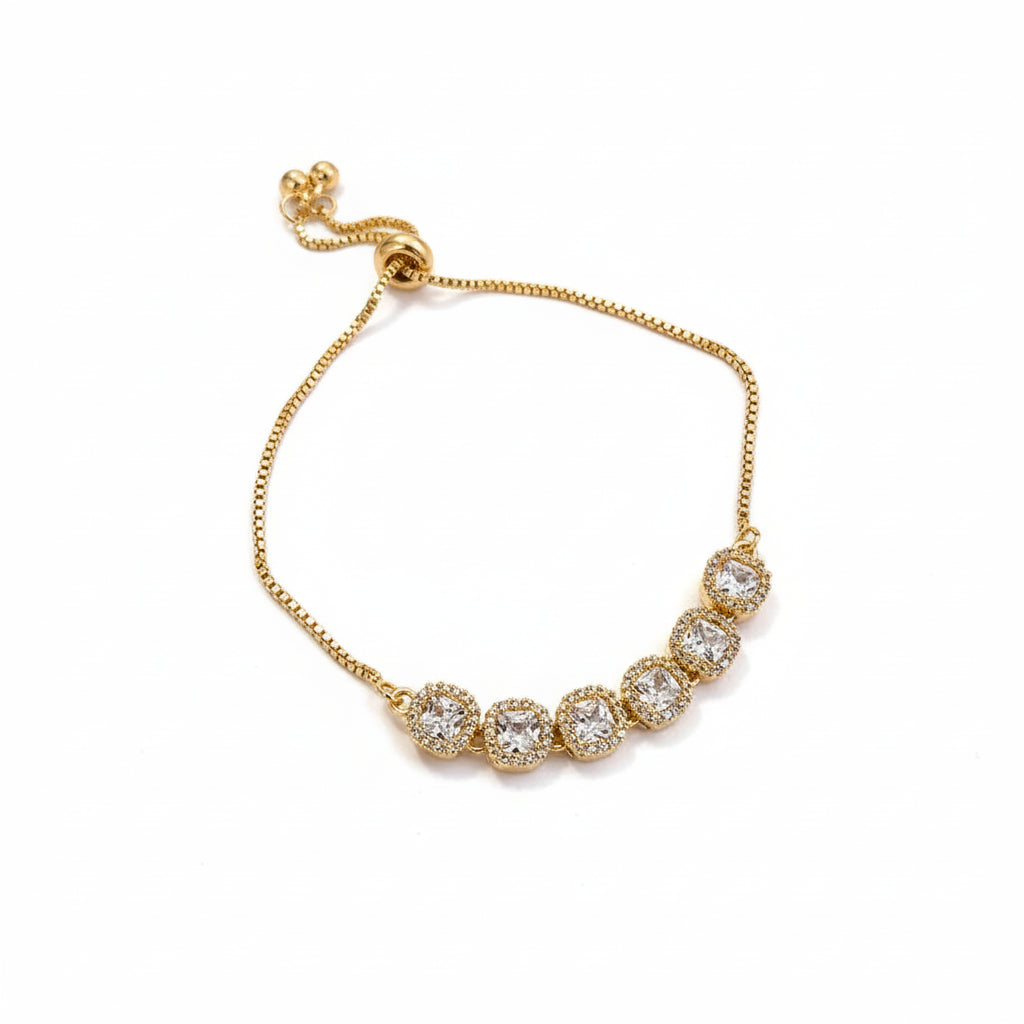 Gold bracelet with diamond-like white background